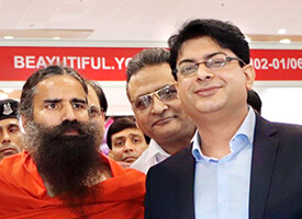 Dr. Navdeep Sharma with Yog Guru, Baba Ramdev, the Co-Founder of Patanjali Ayurveda